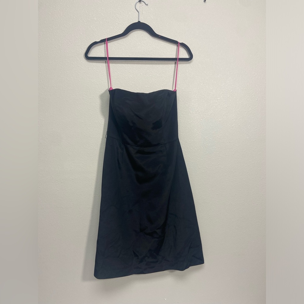 Kathlin Argiro, black, sleeveless dress. Hot pink in the inside.